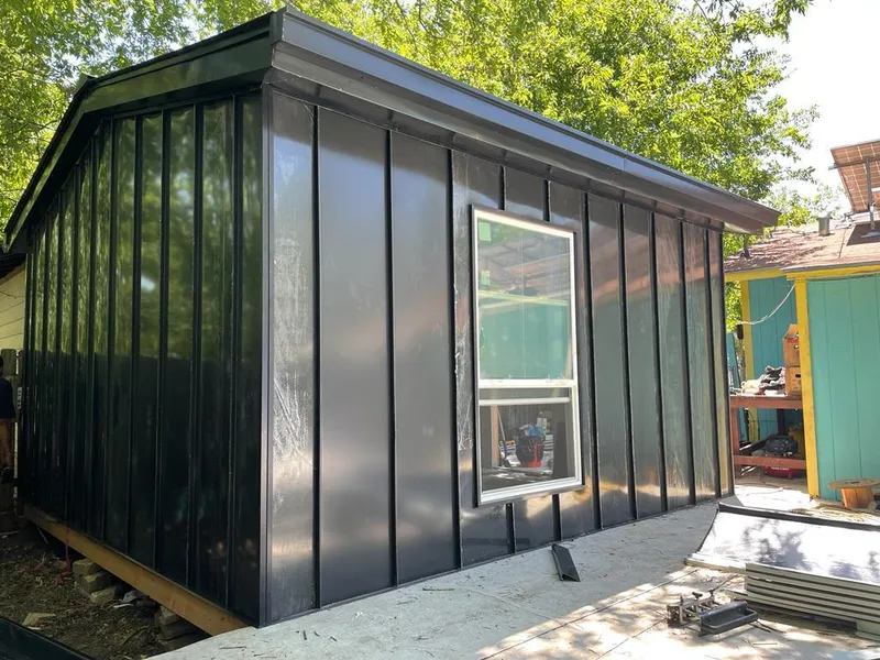 Black standing seam metal wall panels for Metal Roof Installation in Lake Grove