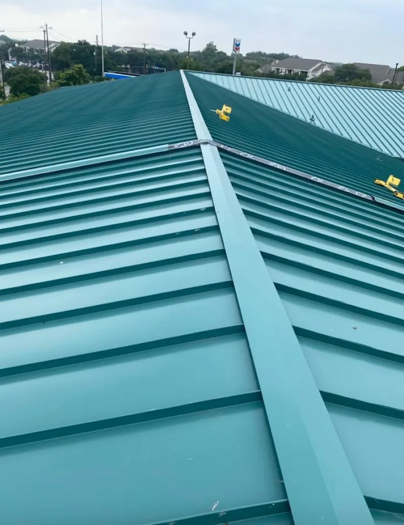Green commercial metal roof ridge and valley for Metal Roof Repair in Lake Grove