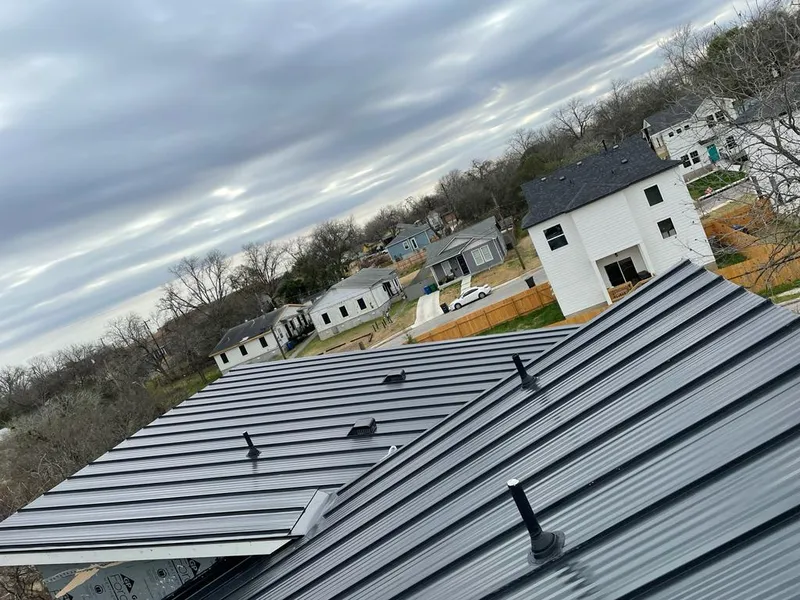 Standing seam metal roof panels with vents for Skylight Repair in Lake Grove